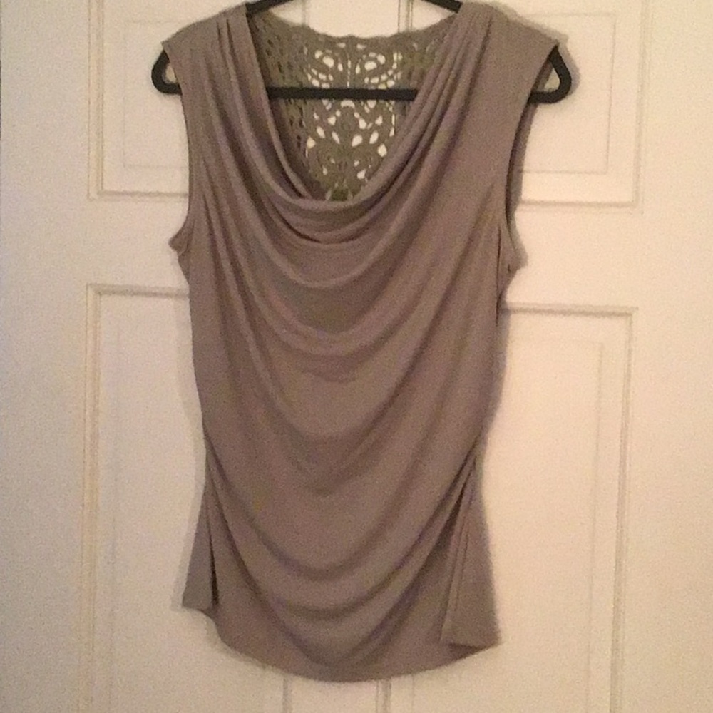 Beige shirt with decorative back.